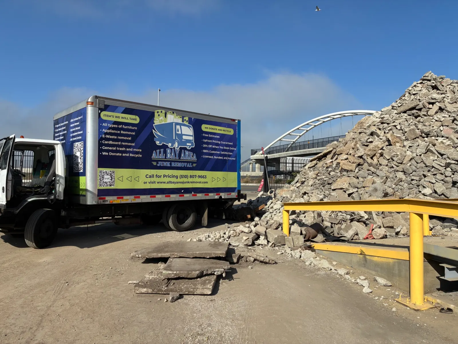 All Bay Area Junk Removal truck at a construction debris site