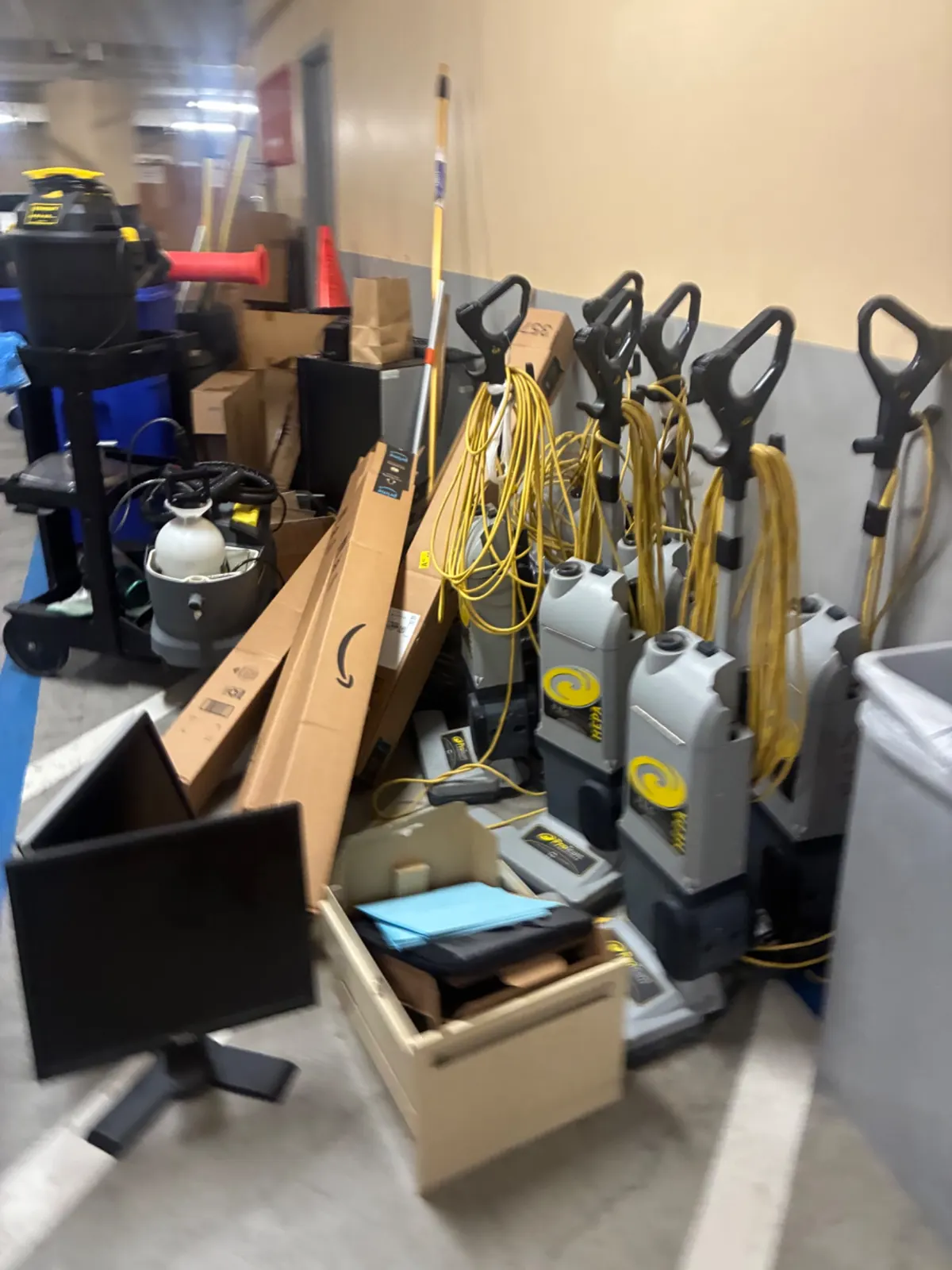 Office equipment and vacuums gathered for haul-away