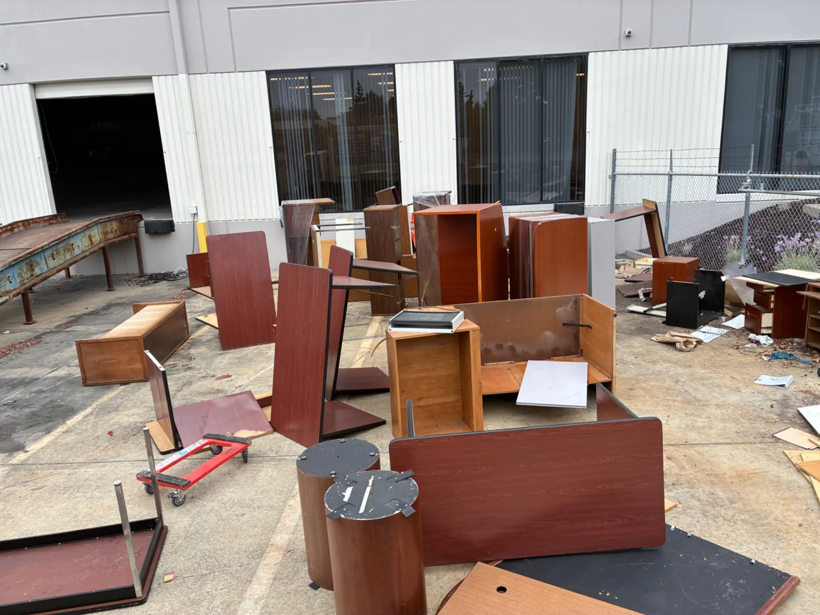 Old office furniture in a lot awaiting haul-away