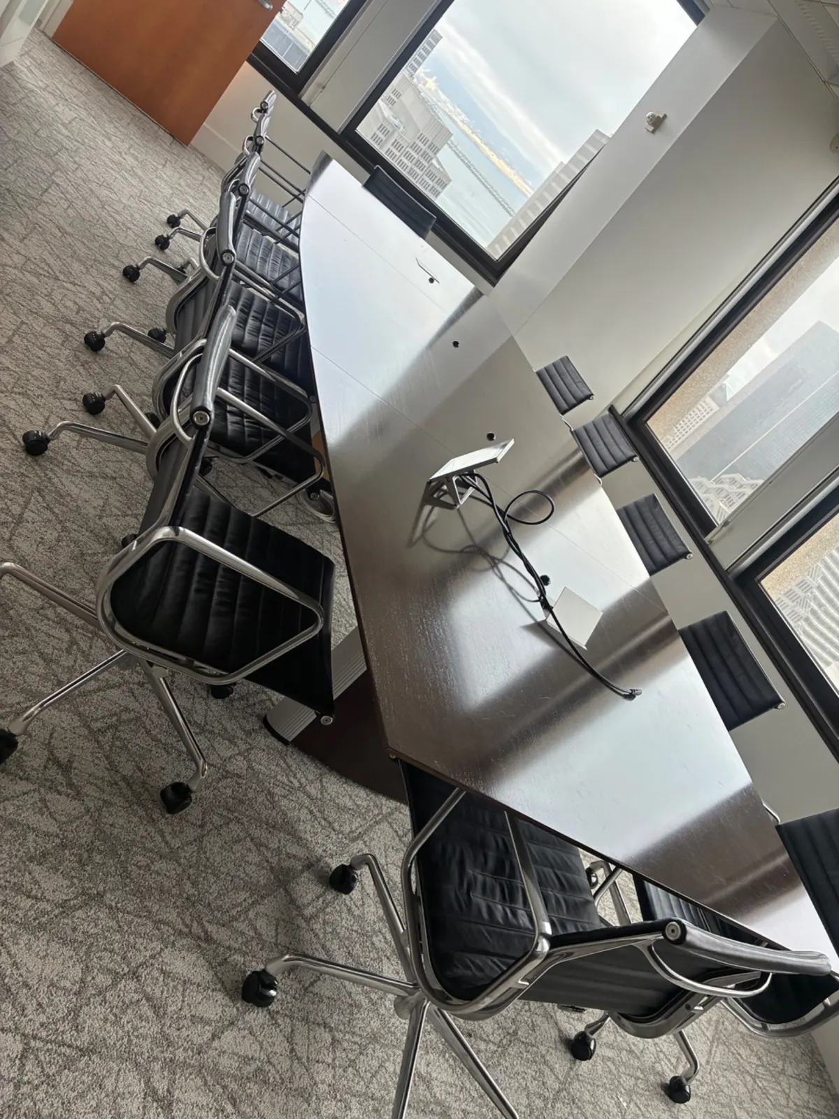 Stacked office chairs and tables for removal