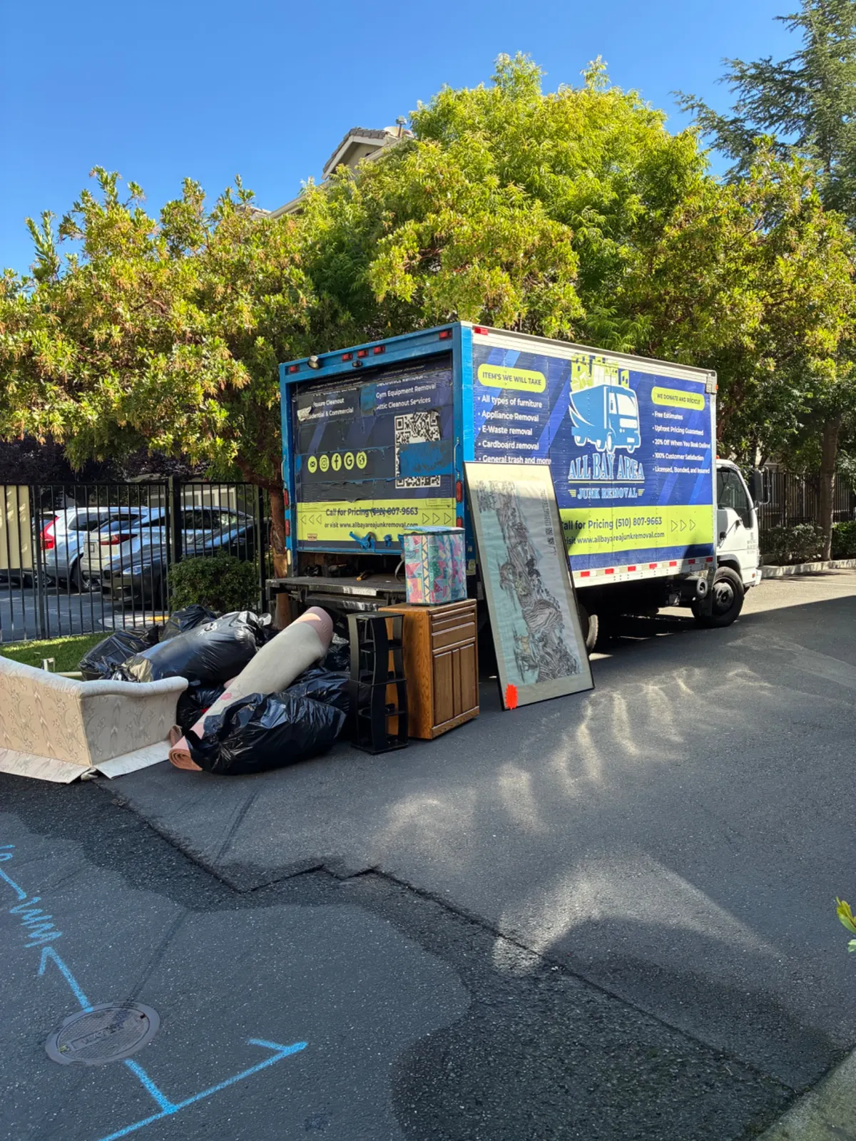 All Bay Area Junk Removal truck on a hillside job