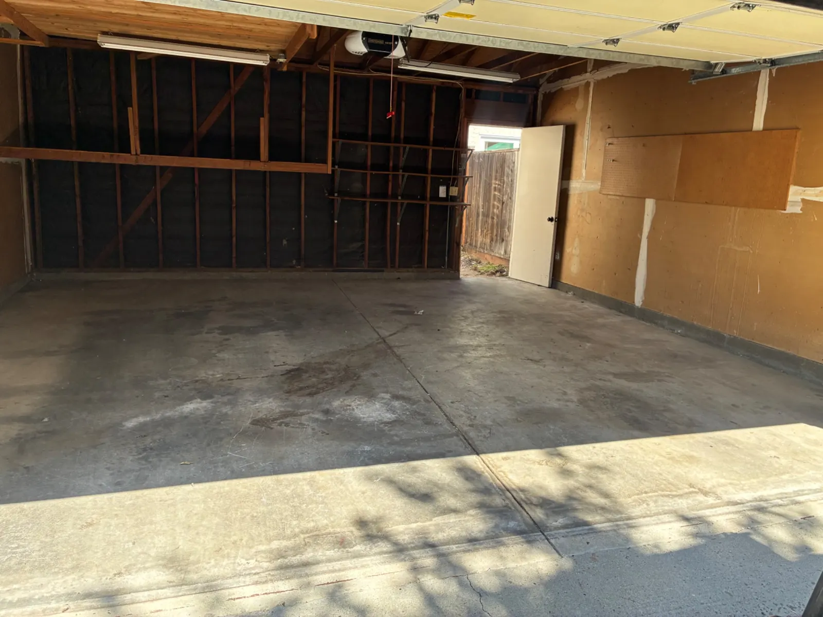 Empty, swept garage after a cleanout