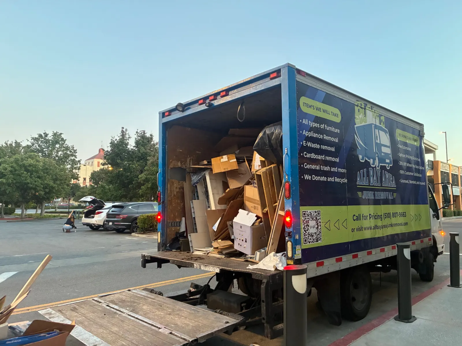 All Bay Area Junk Removal truck loaded with cardboard and junk