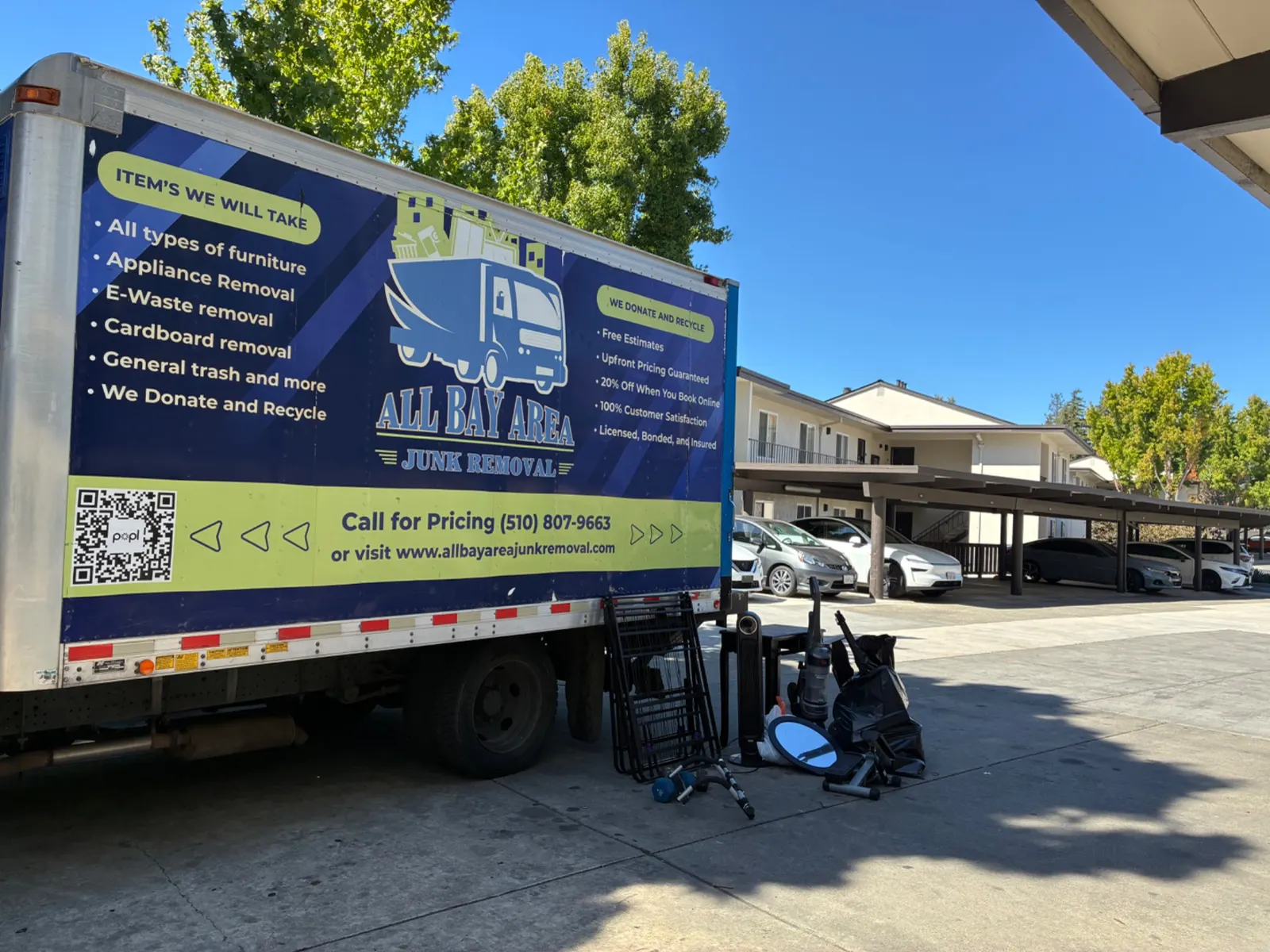 All Bay Area Junk Removal branded truck parked at a Bay Area apartment complex